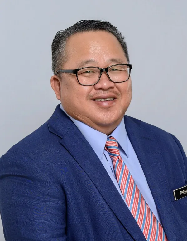 Studio portrait of Datuk Thomas Logijin