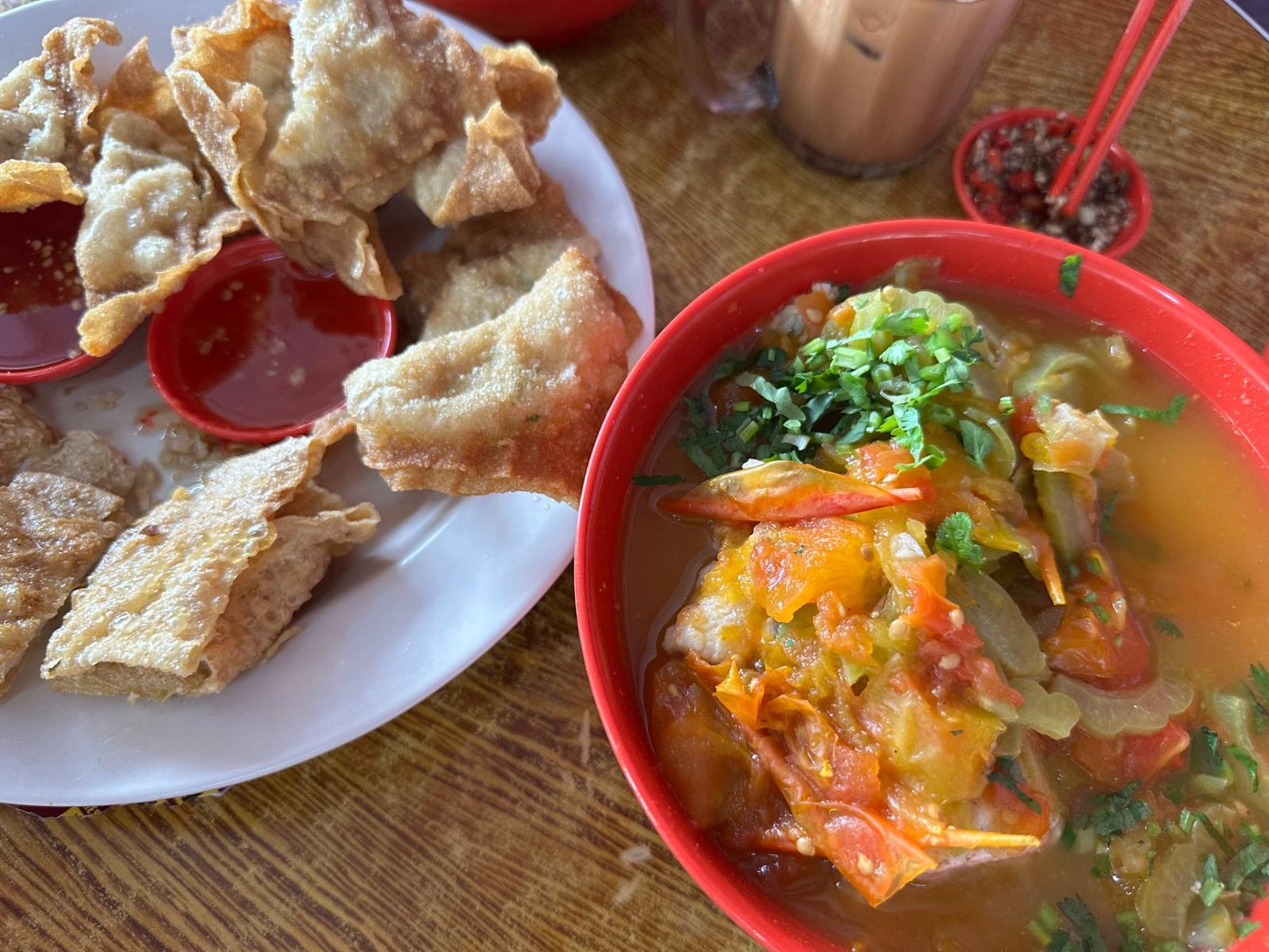 Bowl of Sabah fish noodles in tomato broth